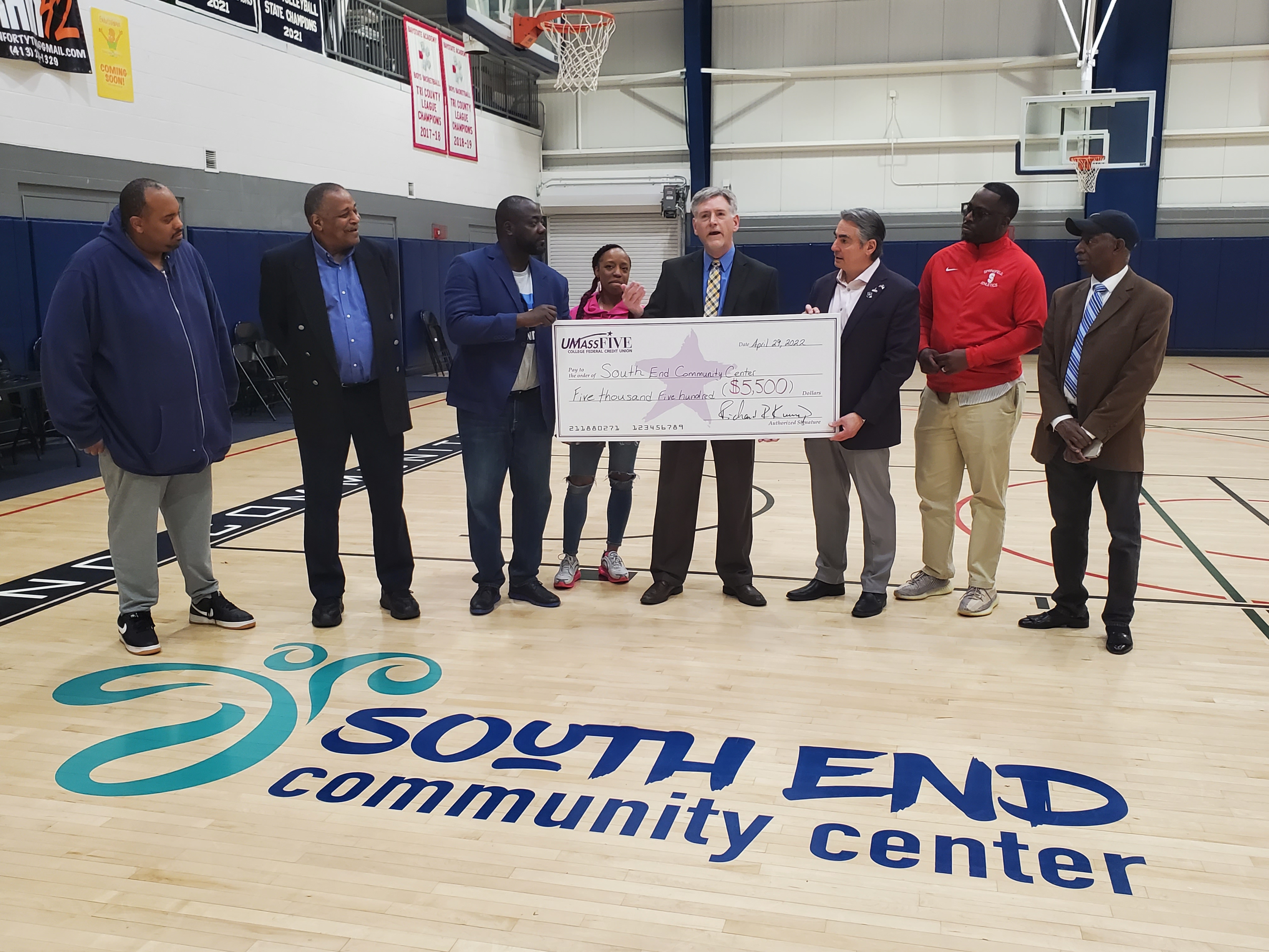 UMassFive check presentation at South End Community Center