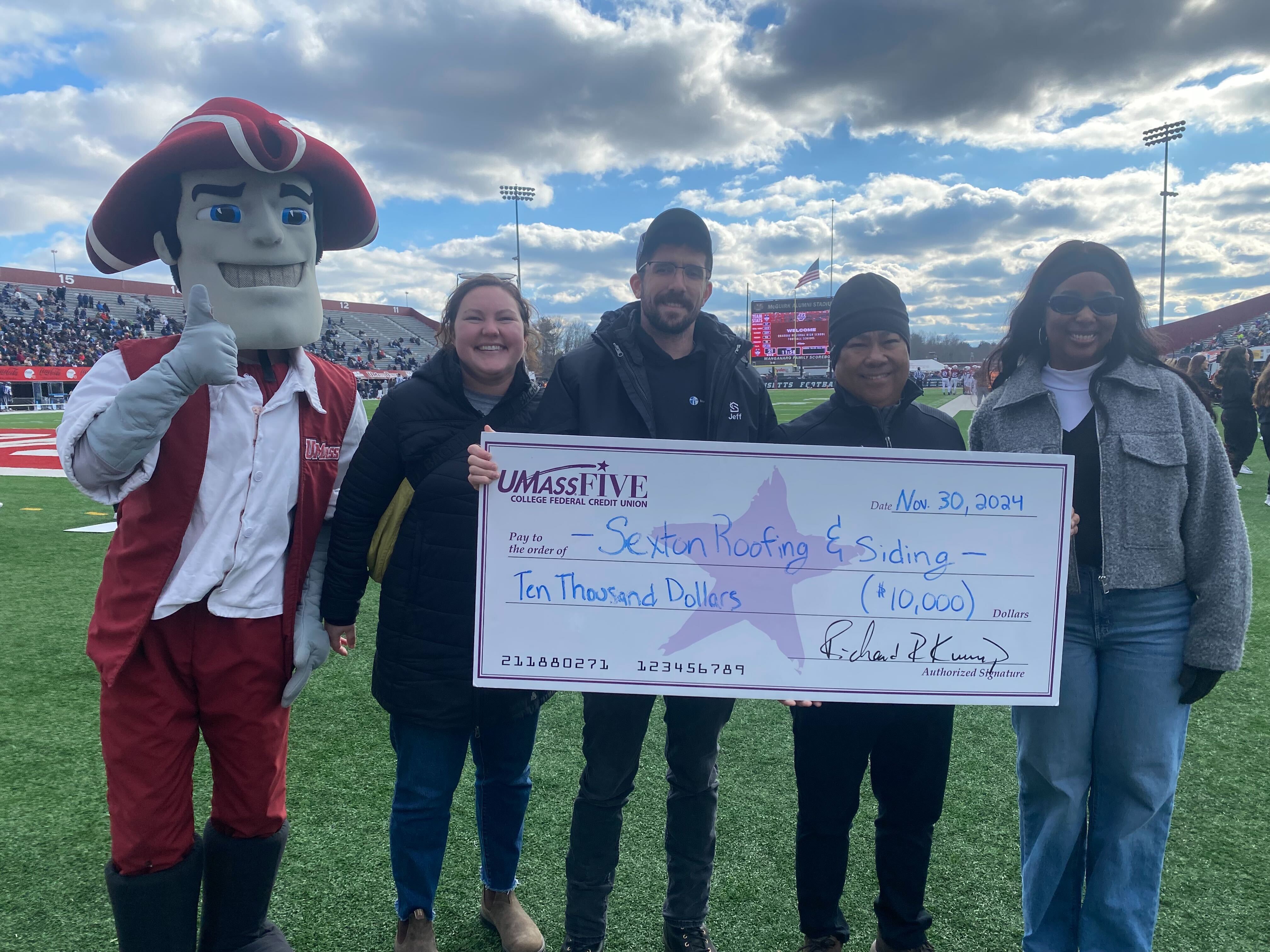 Pictured L to R: Sam the Minuteman; Shelby Downey, UMassFive Cash Management Specialist; Jeff Rockett and Ray Panlilio of Sexton Roofing and Siding; and Eurika Boulay, UMassFive Northampton and Northampton VA Senior Branch Manager.